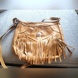 Brand new genuine leather tan fringed crossbody